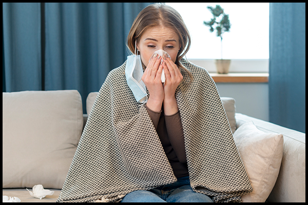 Woman falling sick from cold and possible coronavirus